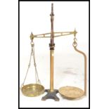 A pair of 19th century Victorian grocers cast metal and brass balance scales. Fitted with a brass