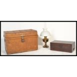 A vintage early 20th Century tin metal travel steamer  trunk, applied travels labels to top for GWR,