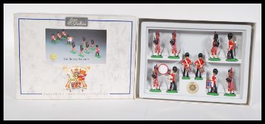 A set of boxed W Britain ' Scots Guards military marching band 'painted white metal model military