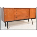 A vintage mid 20th Danish influence Century teak wood sideboard / credenza, having a central bank of