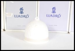 A set of eight Lladro ceramic bells complete in original boxes to include 7613 Spring, 7614