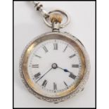 A continental silver 935 ladies pocket fob watch set to a decorative silver albert / chatelaine