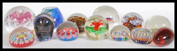 A collection of 20th Century glass paperweights to include bubble control, millefiori, Sankey,