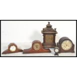 A collection of clocks dating from the 19th Century to include Mantel clocks, Napoleon hat clock