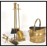 A 19th Century Victorian brass fireside compendium set complete in stand along with a matching