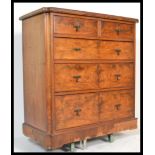 A 19th Century Victorian walnut two over three chest of drawers having brass drop handles and