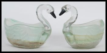 A pair of vintage 20th Century pressed glass planters modelled as swans having black painted beaks