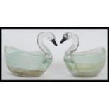 A pair of vintage 20th Century pressed glass planters modelled as swans having black painted beaks