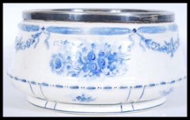 A 19th Century Victorian centre bowl with silver plated collar, the blue and white bowl decorated in