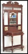 A 19th Century Victorian hall stand having a central bevelled glass mirror panel with inset Minton