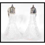 A pair of matching early 20th Century crystal and silver plated ship's claret jugs, both claret jugs