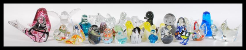 A collection of approx 25 studio art glass paperweights in the form of birds to include `Murano,