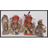 A group cast resin desk top busts in the form of Native American Indians having feathered