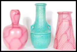 A group of three Art Deco Bretby vases to include a gourd vase with a pink glaze no. 1537C, a