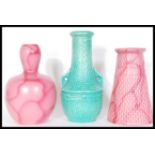 A group of three Art Deco Bretby vases to include a gourd vase with a pink glaze no. 1537C, a