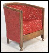 An early 20th Century oak framed  1930's Art Deco tub armchair chair with red floral upholstery