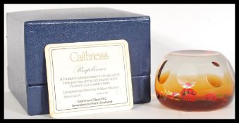 A rare 20th Century Caithness Scotland Glass paperweight entitled Raspberries designed by William