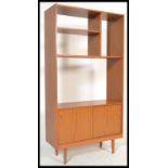 A 1970's retro Danish influence teak freestanding room divider, with configuration of open shelves