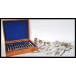 A collection of vintage silver plated wares to include oak cased set of cutlery, loose flatware,