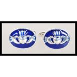 A pair of sterling silver and enamel set cufflinks depicting Irish / Claddagh symbols. Weighs 9