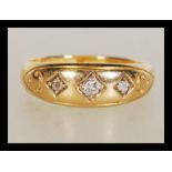 An 18ct gold and diamond 3 stone ring hallmarked for Chester 1910, makers T&S. The diamonds approx