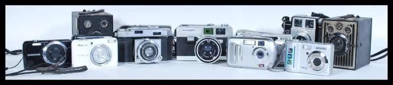 A selection of digital and film cameras to include a Racer film camera, an AGFA Karat film camera, a