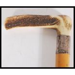 A silver banded hallmarked walking cane, antler ha