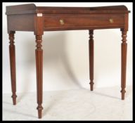 A 19th century mahogany writing table desk in the manner of Gillows. The desk being  fitted with a