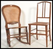 A 19th Century bergere nursing rocking chair having a caned seat and back raised on turned legs