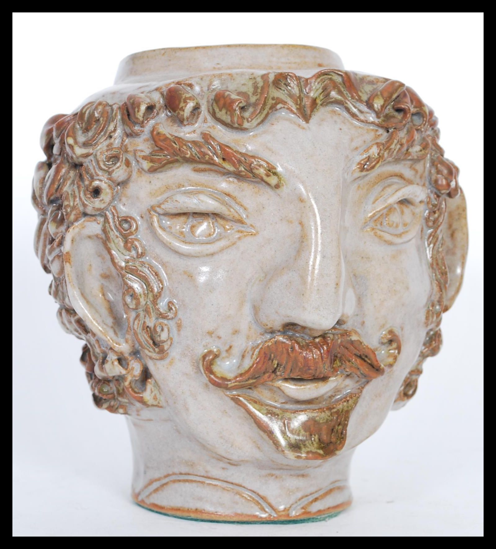 After Paul Gauguin (1848-1903). A 20th Century studio pottery "self portrait" head / jar modelled on