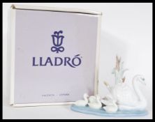 A Lladro ceramic figurine entitled Follow Me depicting swans 05722. Complete in original box.