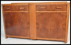 A 1930's Art Deco burr walnut sideboard buffet,two long drawers over two cupboards in the manner