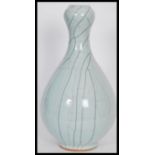 A 20th Century Chinese garlic mouth baluster crackle glaze vase. The baluster body having tapered