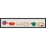 A group of six vintage rings  to include a hallmarked 9ct gold three stone CZ ring, a 9ct gold