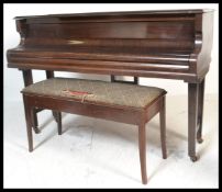 An early 20th Century Challen Sapele mahogany cased baby grand piano with overstrung movement and