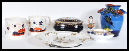 A collection of ceramics dating from the 19th and 20th Century to include Staffordshire mugs,