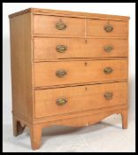 A 19th century Victorian oak chest of drawers being raised on French kick legs with a