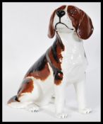 A vintage 20th Century ceramic fireside Beswick model of a beagle dog in a seated position, model