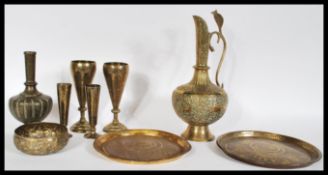 A collection of 20th Century brass wares to include an Indian water jug of bulbous form having