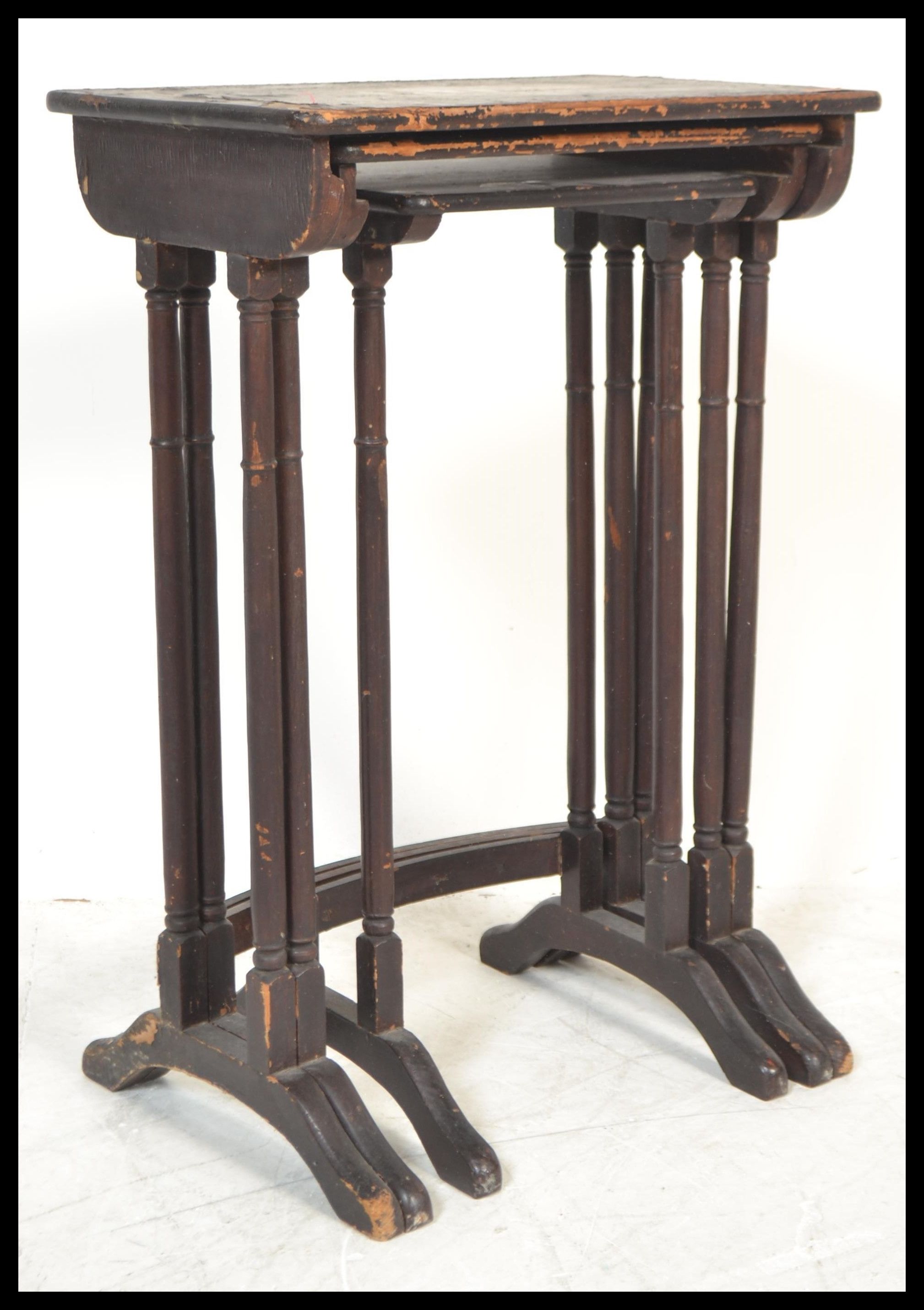 A 19th Century nest of three graduating Japanese silvered black lacquer tables, the tops with pagoda