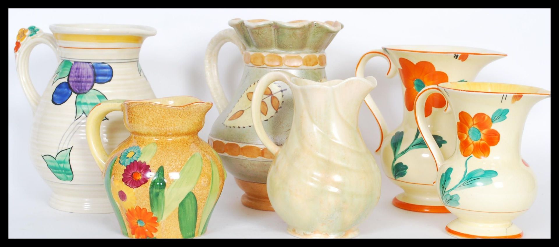 A selection of mid 20th Century hand painted ceramic jugs to include a burleigh ware jug having a - Bild 2 aus 6