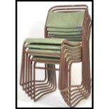 A set of six vintage / retro mid Century village hall stacking chairs, raised on painted tubular