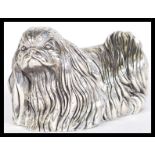 A sterling silver 925 figurine / paperweight in the form of a Pekingese dog having detailed hair and