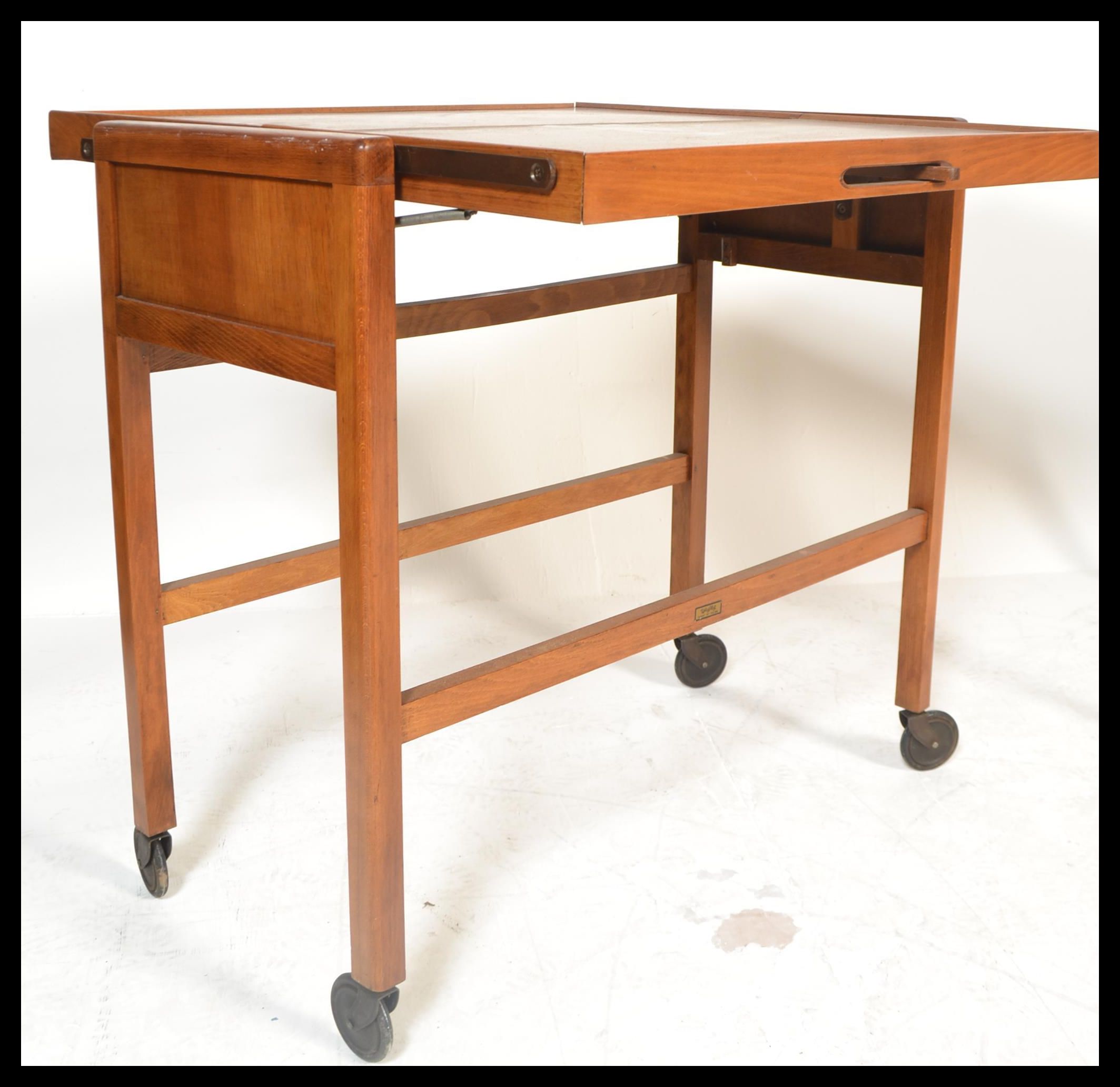 A vintage mid 20th Century teak wood metamorphic buffet trolley raised on square supports on castors - Image 6 of 7