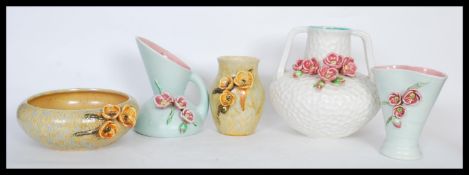 A selection of mid 20th Century Bretby hand made blossom ceramics having matte glazes with