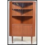 A retro Danish inspired teak wood corner unit display cabinet, glazed sliding doors over open recess