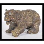 A good quality 20th century bronze figurine of a bear in the Black Forest taste having detailed