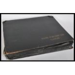 A mid to late 20th Century vintage postcard album of local interest within a leather album with gilt