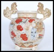 A Chinese urn / vase of bulbous form having hand painted scenes of people in traditional dress