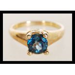 A hallmarked 9ct gold ring prong set with a London Blue Topaz stone. Hallmarked Birmingham. Weight